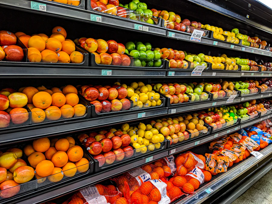A brightly lit supermarket aisle stocked with fresh produce
