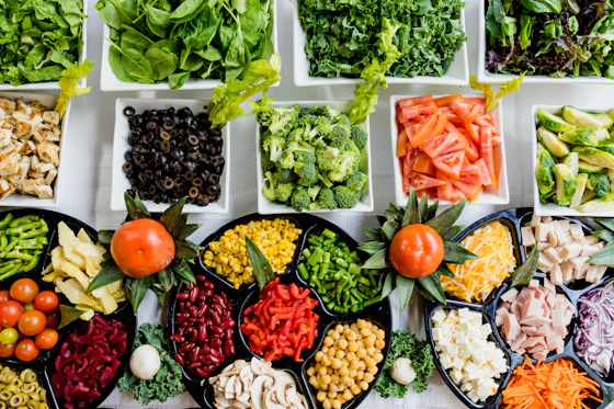 An overhead grid of pulses, grains, greens and vegetables