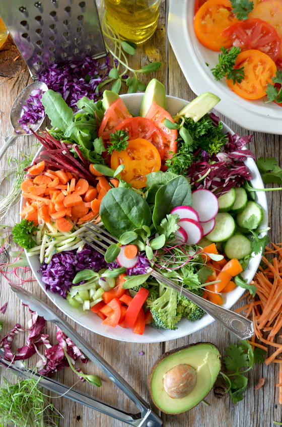 A large platter of raw salad vegetables